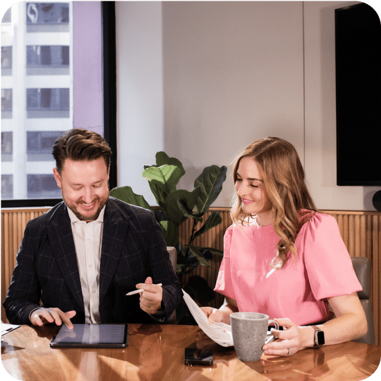 Julia and Chris at a desk working
